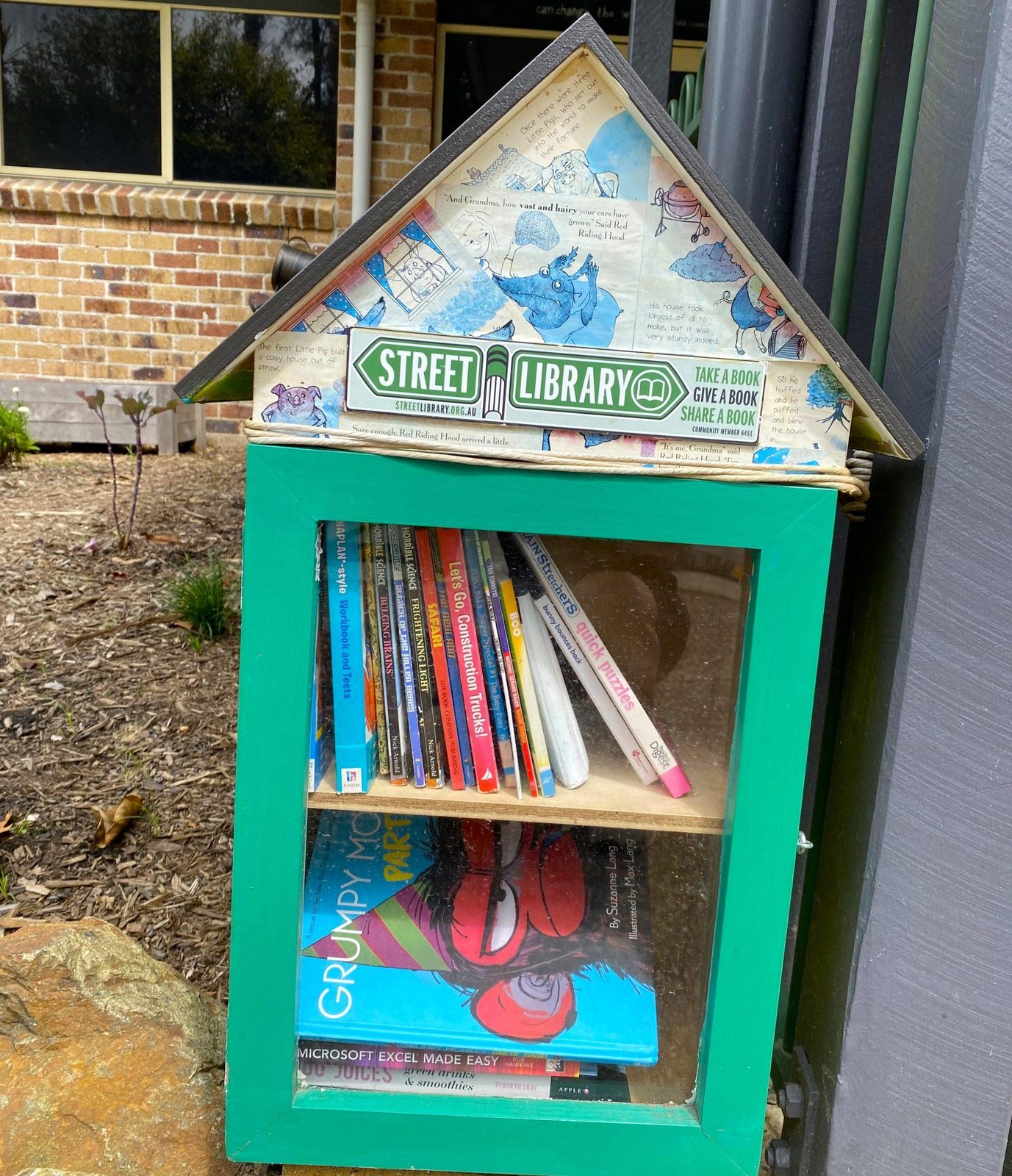 Street library book box at the front of the centre