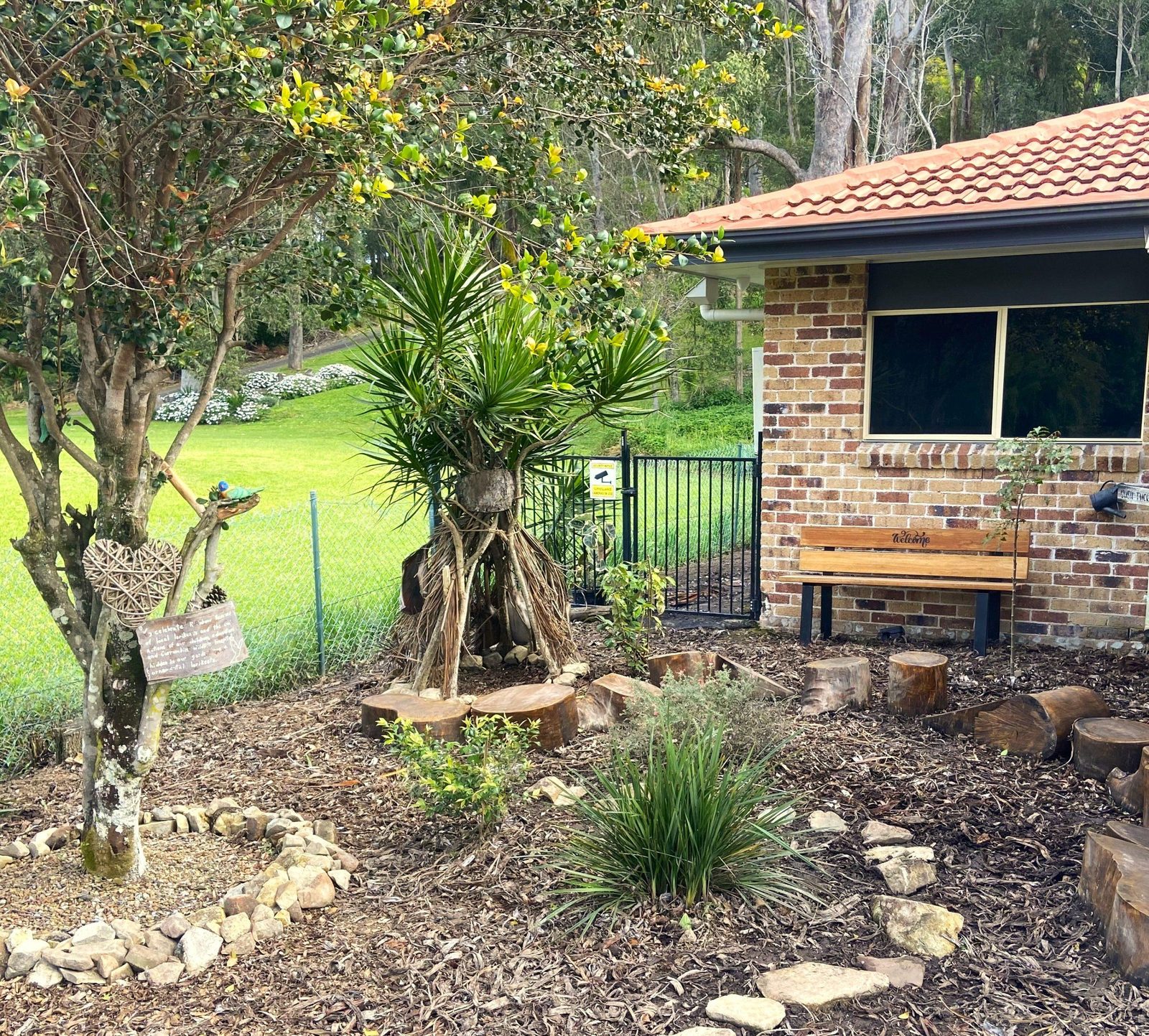 Natural playground with logs, plants and shade at Currumbin Village